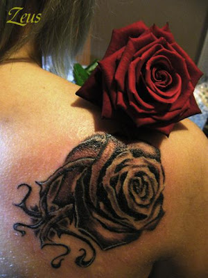 Get a Rose Tattoo is great. Besides the roses are the best tattoo designs,