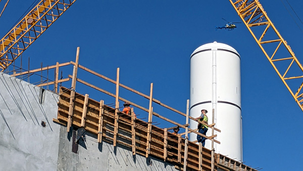 One of space shuttle Endeavour's twin solid rocket motors stands tall at the construction site for the California Science Center's Samuel Oschin Air and Space Center in Los Angeles...on November 8, 2023.