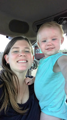 Having fun in the tractor with Mom