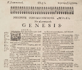 The first page of Genesis in the Eliot Bible.