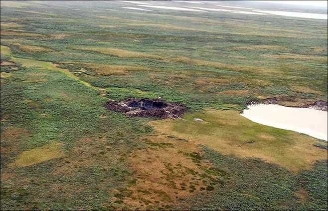 http://www.themoscowtimes.com/news/article/mystery-of-giant-hole-in-siberia-unraveling-with-2nd-discovery/503858.html