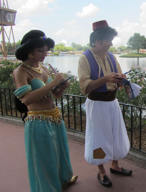 Princess Jasmine and Aladdin Signing Autographs in the World Showcase Epcot Disney World