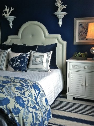 Dramatic Coastal Bedroom Design with Dark Blue Painted Walls