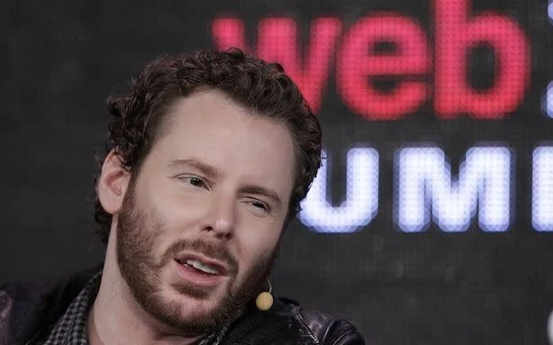 On Parker from shoulders up with a sarcastic physical look on face wearing black leather jacket wearing black leather jacket
