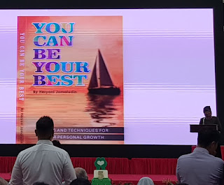 You can be your Best by Heryani Jamaludin (at podium) is another of the books launched at the Club HEAL event.