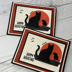 Halloween card showing mouse and cat in silhouette looking at the moon