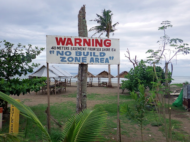 a "No Build Zone" warning on the entrance to Red Beach in Baras, Palo, Leyte