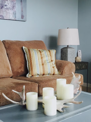 trunk, beach house, antlers  and candles