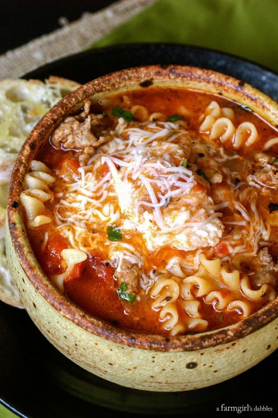 This Lasagna Soup is truly like lasagna in a bowl. It’s packed with the familiar flavors of lasagna, with an ooey-gooey cheesy concoction that gets stirred in right before eating. Total cheesy YUM!