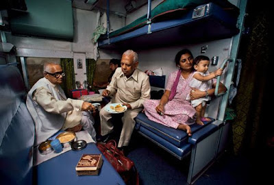 Indians eating food in train coaches happily