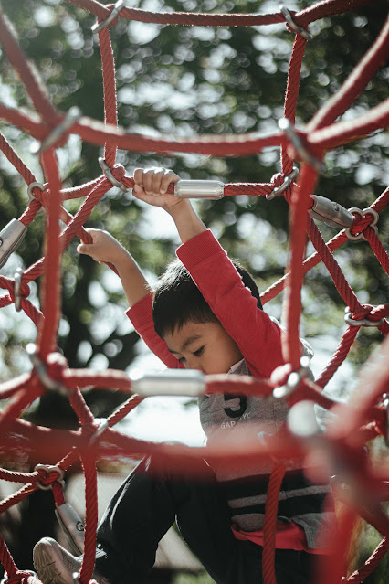 child climbing:Photo by Aedrian on Unsplash