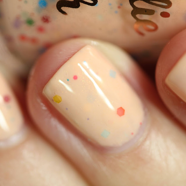 peach nail polish with rainbow glitters