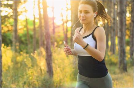 A woman running while listening to music.