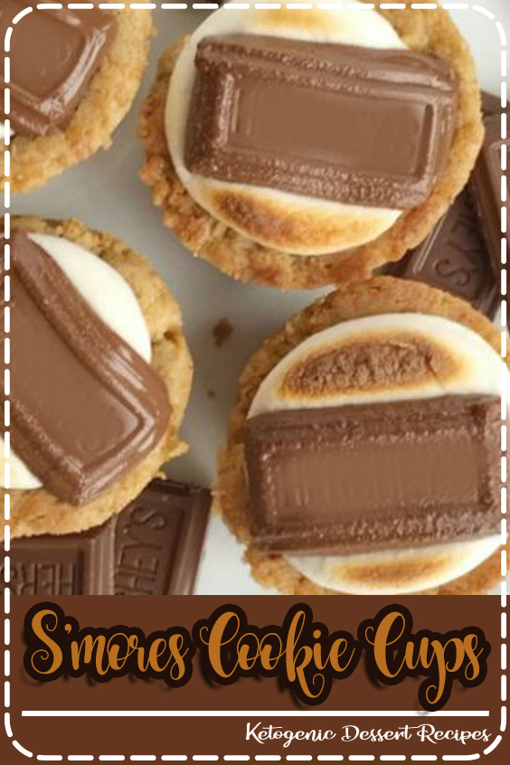 S'mores cookie cups are baked in a mini muffin pan - Graham cracker cookie base, with a toasted marshmallow, and a piece of gooey chocolate on top. #smores #summerrecipes #dessert #dessertrecipe #smorescookie #recipe #food #recipes