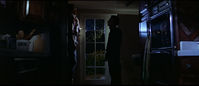 Michael Myers pins Bob to the door in HALLOWEEN (1978)