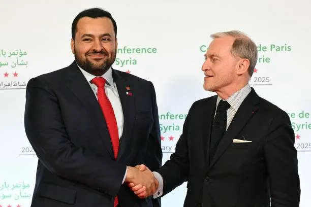 Qatar's Minister of State for Foreign Affairs Mohamed Bin Mubarak Al-Khulaifi (left) shakes hands with French diplomat Franck Gellet in Paris on February 13, 2025. Photo by Bertrand Guay/AFP