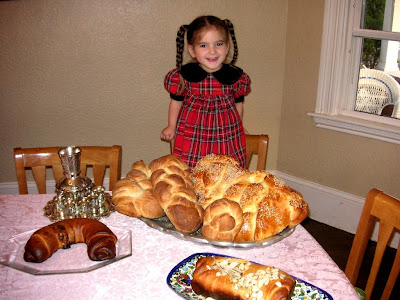 Gretta surveying lots of baked goods, Shabbat Shalom!