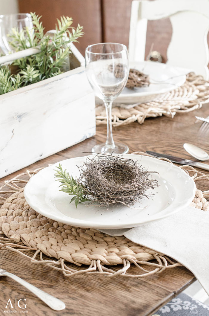 Spring tablescape idea - a gathered nest displayed on each plate with 