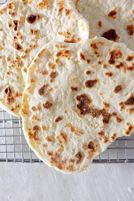 closer view of mashed potato flatbreads on cooling rack