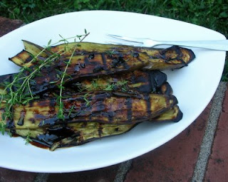 Simple grilled eggplant topped with fresh thyme and drizzled with a balsamic & honey syrup