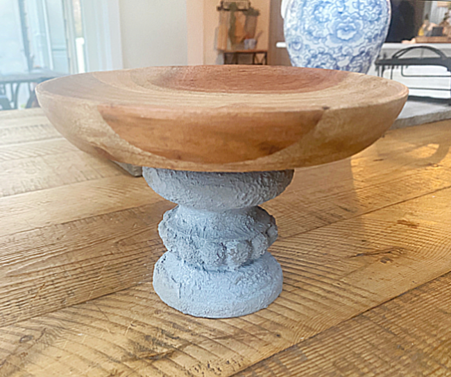 wooden dish on cement pedestal