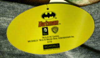 Back of gray distressed Batman t-shirt label