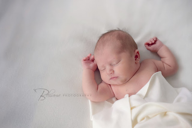 cute newborn baby on white blanket