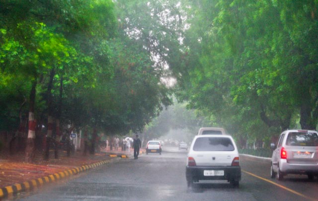 Monsoons in Capital of INDIA ( DELHI ): Posted by VJ Sharma on www.travellingcamera.com : Now monsoon is there in Delhi and probability of traffic jams has increased in capital city of INDIA. Here are few photographs clicked during monsoon season of 2010...As per my definition, Monsoon is a much awaited season after scorching summers and people get bored of this season soon :-)I enjoy rains at times but these should not be continuous... Rains bring freshness in our surroundings but they can ruin many other things due to this continuous behavior... Two senior people struggling with heavy rains and fog of Delhi to reach office in morning @ 10:30 AM... A scene of dense fog near Lodhi estate near India Islamic Center...A scene of dense fog near Lodhi estate near India Islamic Center...Flyover work going on for Common Wealth games in INDIA this year (2010)