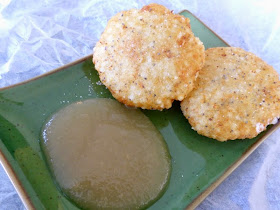 Fritters on a platter with sauce