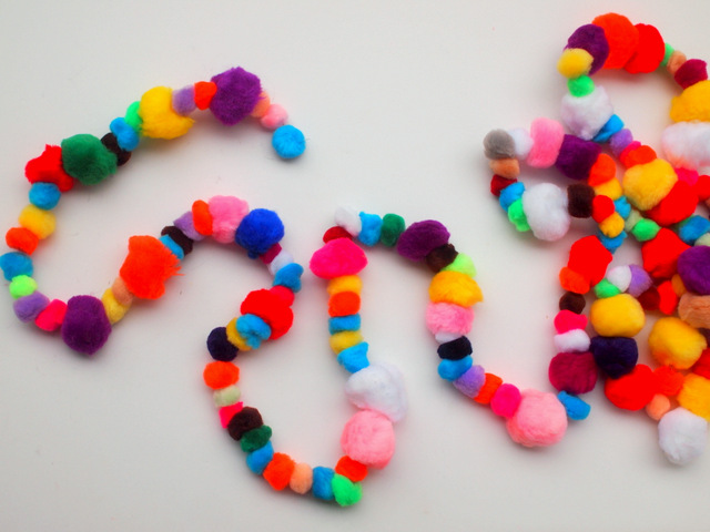 how to make a pom-pom garland- the absolute easiest craft with adorable results!  