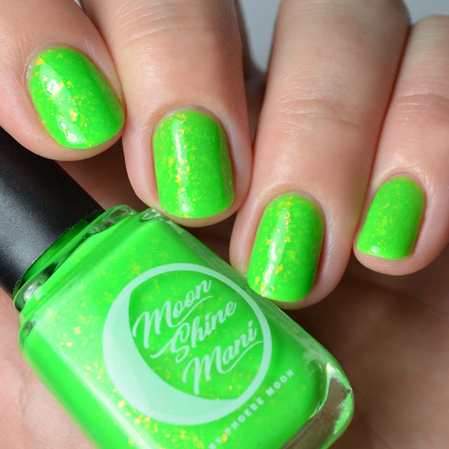 bright green nail polish with flakies four finger swatch