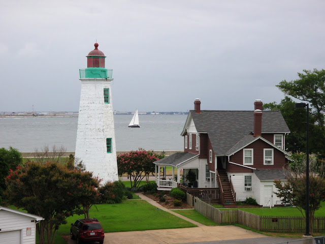lighthouse and sailboat