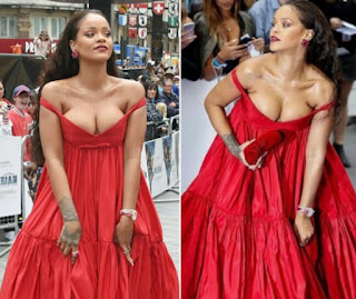 Rihanna Struggles With Her Boobs Popped Out In Low-Cut Scarlet