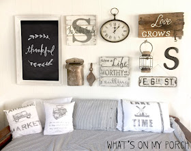 Farmhouse gallery wall with chalkboard, daybed, pillows, wood sign, clock