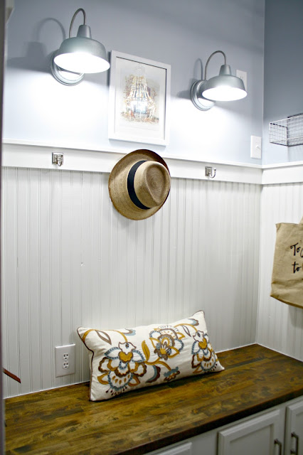 Beadboard with trim and hooks in mudroom