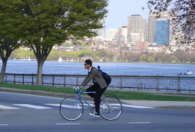 converse sneakers on a bike in Boston