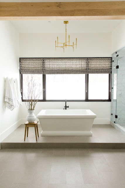 Raised floor in bathroom with freestanding tub