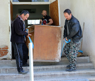 Carefully beginning to come down the stairs