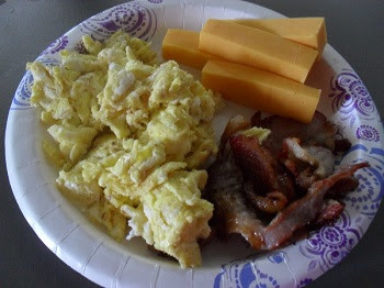 Scrambled Eggs, Lean Bacon, Cheddar Cheese Sticks