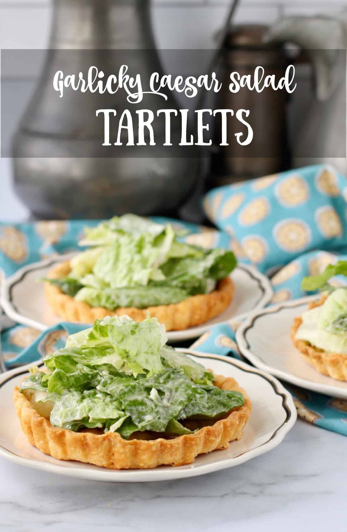Caesar Tartlets with Sweet Garlic Butter Crusts on plates.