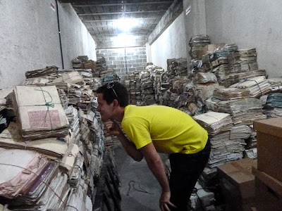 Max in a room full of documents