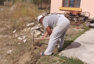 Starting to dig the trench in the hot sun