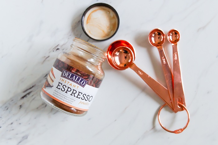 espresso powder with copper measuring spoons