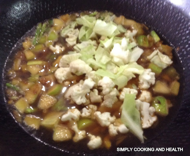 Adding cauliflower and cabbage