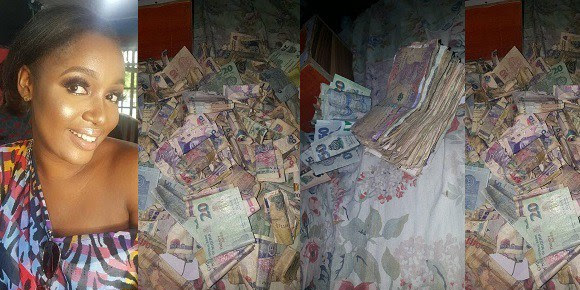 Nigerian Lady Shows Off Cash She Garnered From Her Piggy Bank After Four Months Of Saving. (Photos)
