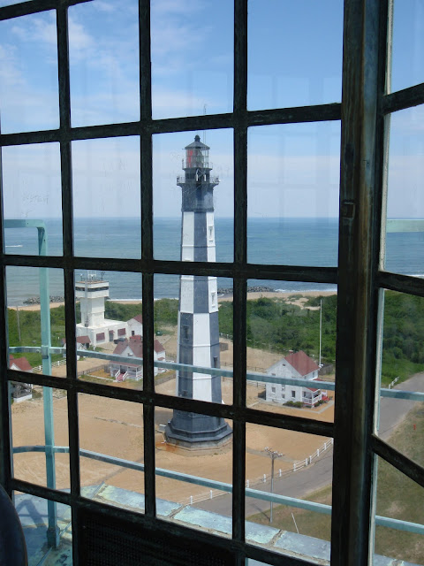 view of the New Cape Henry Lighthouse from the top of Old Cape Henry