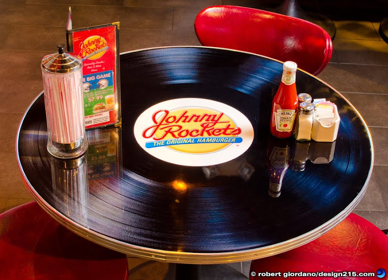 Photo of a table shaped like a phonograph record at Johnny Rockets, Copyright 2012 Robert Giordano