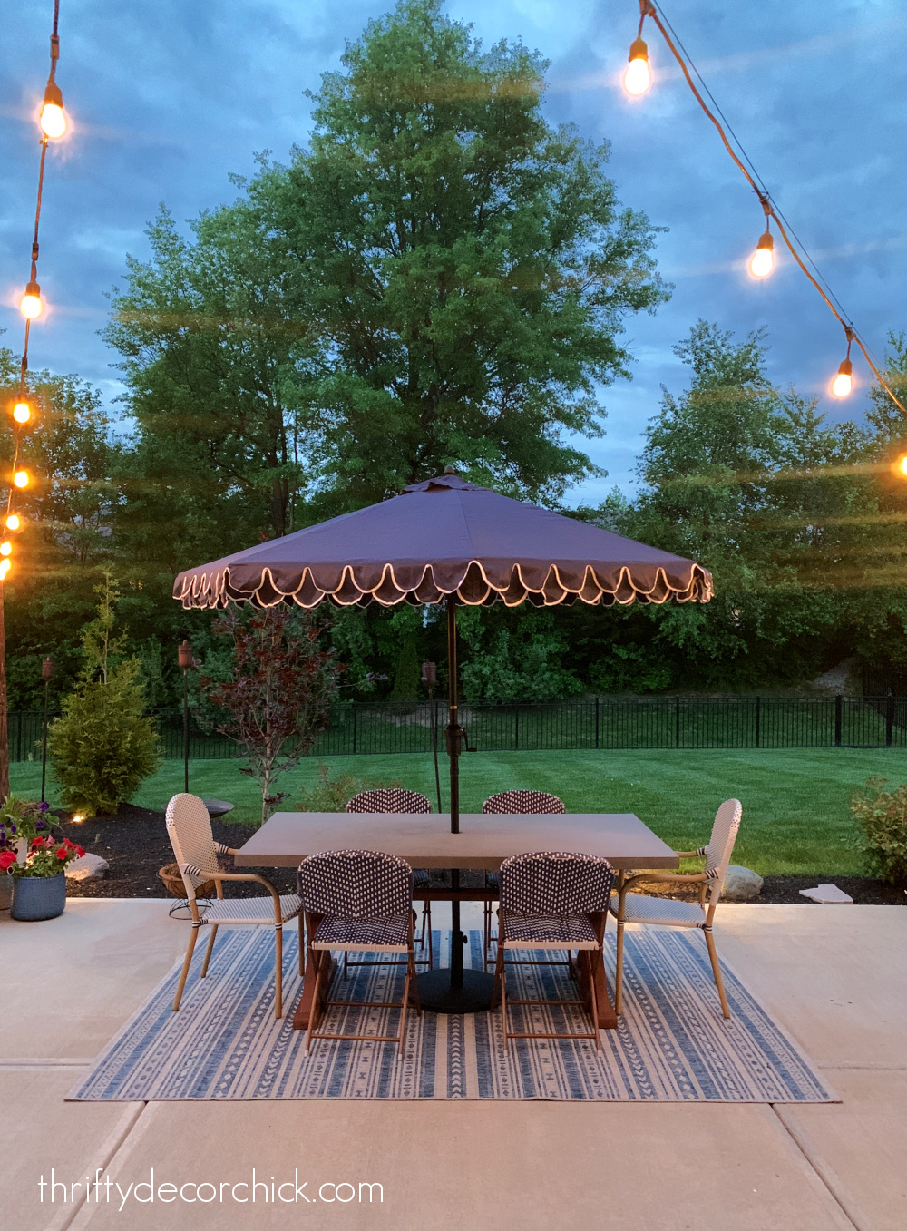 scalloped umbrella over dining table
