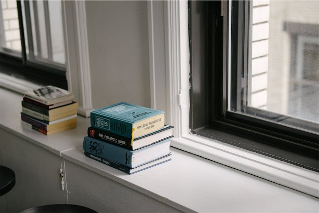 3/21. Long Shelf Facing a Glass Door.