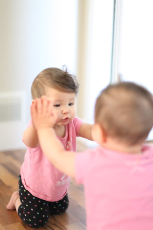 NAMC montessori infant toddler environment preparing for movement touching a mirror